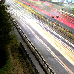 Long exposure car lights traces on highway in the night. Almaty
