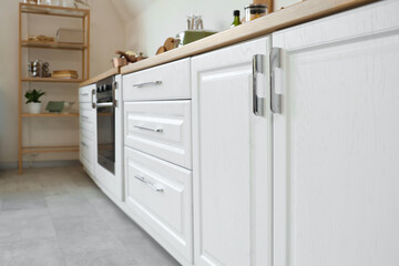 White counters with drawers in light kitchen
