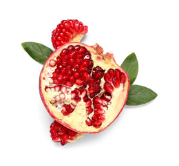 Half of fresh ripe pomegranate and leaves on white background