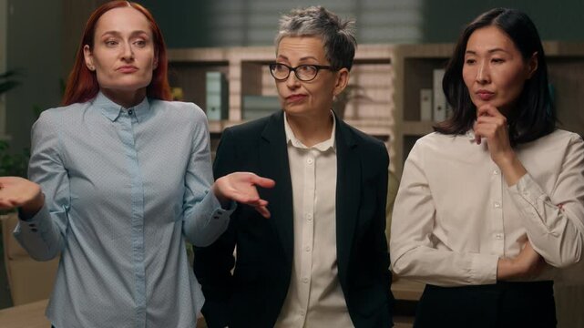Diverse thoughtful puzzled women thinking pondering find answer Caucasian lady shrug shoulders uncertain adult woman leader solution Asian Korean female raise finger idea businesswomen business office