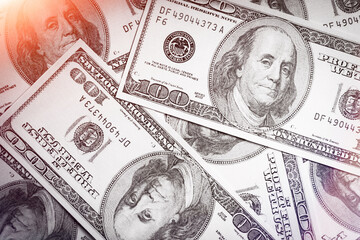 Background from dollar bills. Money background. Pile of money on the table. One hundred dollars..