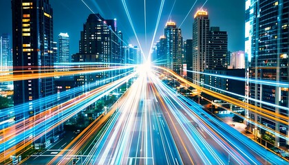 A cityscape at night with streaks of light from moving cars.