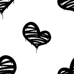Seamless pattern of sprayed heart with overspray in black over white. Vector illustration.
