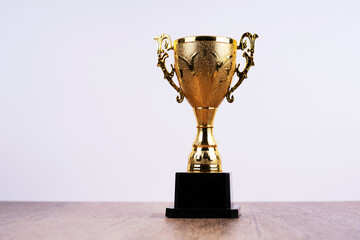 Gold trophy on white background