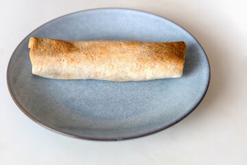 Delicious fried roll on a plate