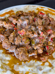 Turkish Food Hunkar Begendi with creamy eggplant puree, bechamel sauce and roasted meat stew topping. Closeup of sultans dish from Ottoman cuisine. Traditional flavor concept