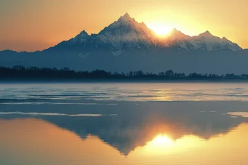 Printed kitchen splashbacks Majestic sunrise paints a snow-capped mountain range reflected in a still, icy lake.