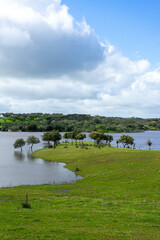 Monte Novo Dam at its maximum water level, supplying &Eacute;vora, Alentejo, Portugal. A serene landscape reflecting the abundance of water in the region.