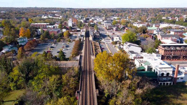 Fredericksburg Virginia aerial cinematic video of the skyline and Rappahannock River during autumn.