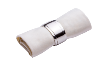 Elegant white cloth napkin in silver ring holder on black background, cut out