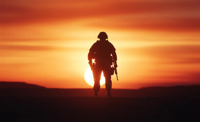 A silhouette of a soldier standing in front of a vibrant sunset, holding a rifle, symbolizing strength, courage, and resilience.