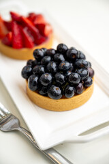 Close up of French Blackberry and Strawberry Tarts