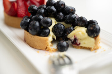 Close up of French Blackberry and Strawberry Tarts