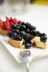 Close up of French Blackberry and Strawberry Tarts