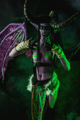 Demon Hunter Demon Cosplay on Black Background in Green Light