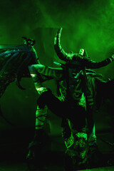 Demon Hunter Demon Cosplay on Black Background in Green Light