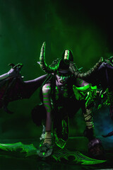 Demon Hunter Demon Cosplay on Black Background in Green Light