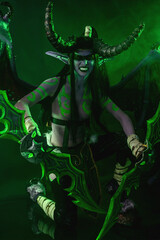 Demon Hunter Demon Cosplay on Black Background in Green Light