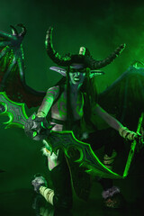 Demon Hunter Demon Cosplay on Black Background in Green Light