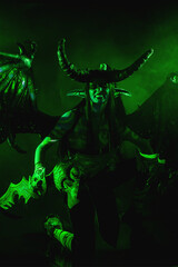 Demon Hunter Demon Cosplay on Black Background in Green Light