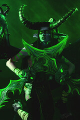 Demon Hunter Demon Cosplay on Black Background in Green Light