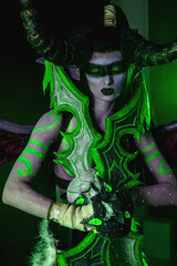 Demon Hunter Demon Cosplay on Black Background in Green Light