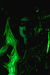 Demon Hunter Demon Cosplay on Black Background in Green Light