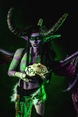 Demon Hunter Demon Cosplay on Black Background in Green Light