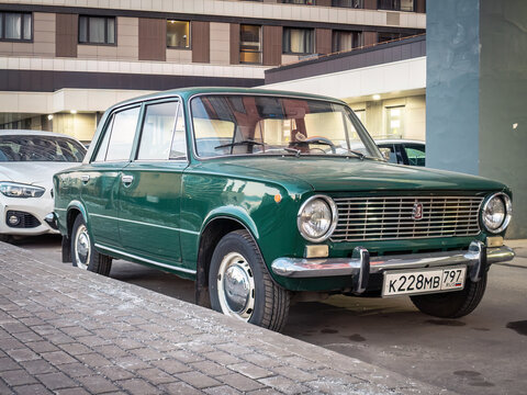 Classic Lada 1200 car parked in the backyard. Old Soviet car VAZ 2101