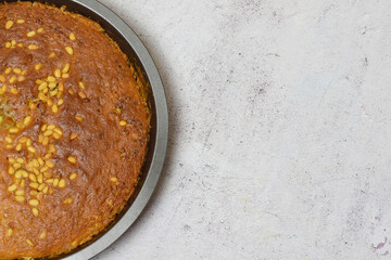 Homemade sponge cake with pine nuts and chocolate.