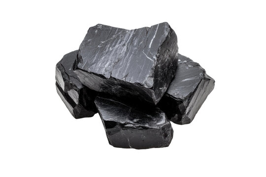 Pile of rough black shungite stones on black background, cut out