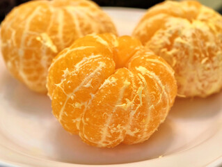 Exquisite citrus delicacies displayed on a plate, showcasing their bright orange color and inviting textures