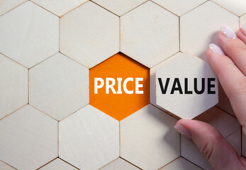 Price and Value symbol. Concept word Price and Value on wooden comb puzzle. Businessman hand....