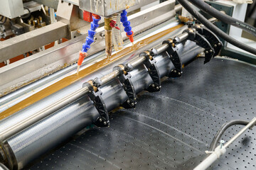 Efficient glue applicator in action during an automated manufacturing process for seamless adhesion