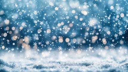 Fototapeta premium Snowflakes falling against a blurred blue background with bokeh lights