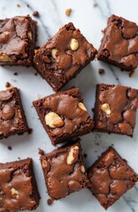 Delicious homemade brownies on marble background. Close-up chocolate pie pieces, top view flat lay composition. Sweet pastry dessert for cafe menu, holidays. Tasty brownie squares.