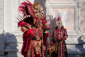 Venice, Italy - People dressed in carnival masks are photographed by tourists in the scenery of the...
