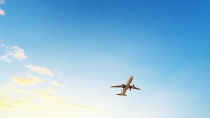ULTRA HD. Airplane flies in blue sky. Travel. Airplane takes off against the background of blue sky.	
