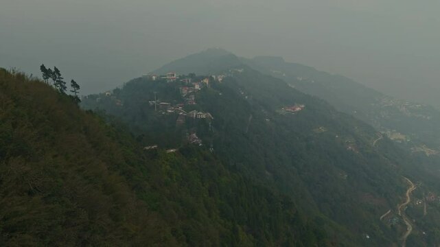 Aerial, drone shot 4k. Aerial view of the foggy day in Pelling, Sikkim. Northern India. Indian Mountain. D Log. Bird eye View. Travelling Northeast Video. Indian mountain village. IN front of Skywalk