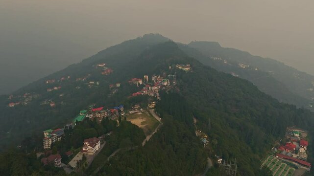 Aerial, drone shot 4k. Aerial view of the foggy day in Pelling, Sikkim. Northern India. Indian Mountain. D Log. Bird eye View. Travelling Northeast Video. Indian mountain village. IN front of Skywalk.