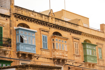 The nearly empty St. Margaret Street in Cospicua. Perhaps a reflection of the times. Triq Santa Margerita, Bormla.Cospicua,View at St Paul's Church Cospicua through a street with many colorful bay 