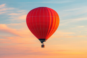 Fototapeta premium A vibrant red hot air balloon gracefully floats against a breathtaking sunset sky.