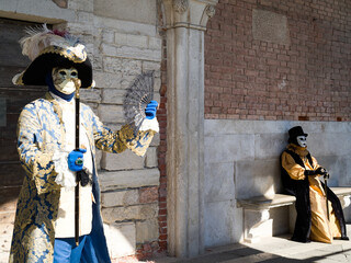 Venice, Italy - People dressed in carnival masks are photographed by tourists in the scenery of the...