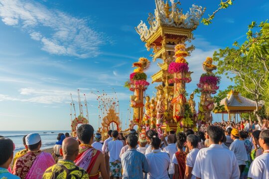 A vibrant Balinese Hindu cremation ceremony procession unfolds on a sunny beach, showcasing ornate golden structures adorned with flowers.