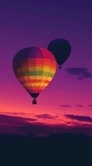 Fototapeta premium Colorful hot air balloons at purple sunset
