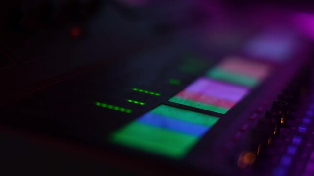 sound mixer close-up. Low view of moving buttons on dj remote or soundboard. Working process in recording studio.