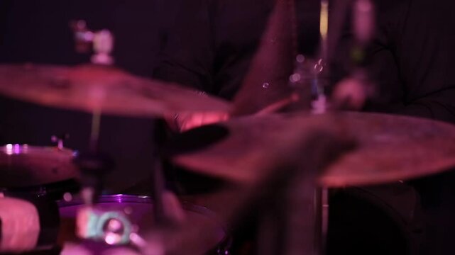musician playing drums on stage. rhythm performance on drums