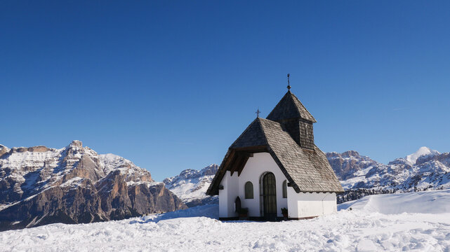 background of landscape with cute little church in the Dolomites ski resort mountains