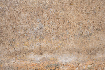 Processed collage of ancient yellow block wall texture. Background for banner, backdrop or texture for 3D mapping.A rectangular slab of light sandstone against the background of stone fragments as the