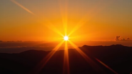 Fototapeta premium Vibrant sunrise over mountain range with radiant sunburst and golden sky